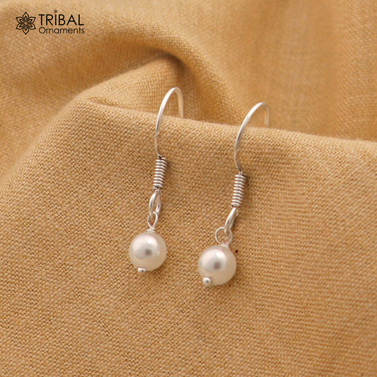 Sterling silver hoop earrings with pearl stones, lightweight and stylish, featuring delicate and elegant jewelry design by Tribal Ornaments.