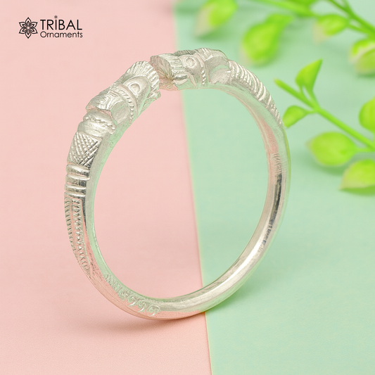 Silver baby bangle from TRIBAL ORNAMENTS featuring a vintage tribal design, adjustable solid 999 fine silver unisex kids kada.