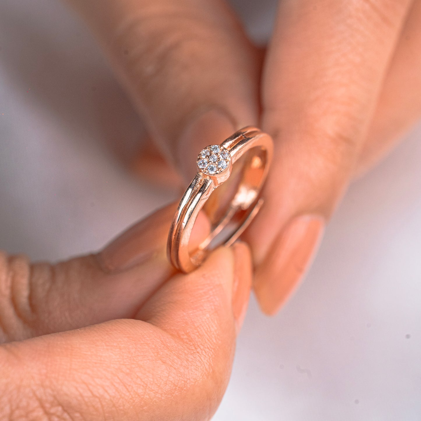 White diamond stylish rose gold and silver ring by TRIBAL ORNAMENTS featuring intricate design and sparkling gemstone accents.