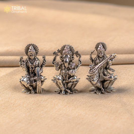 Small 2-inch handmade 925 sterling silver Hindu idols of Ganesha, Lakshmi, and Saraswati for puja rituals by TRIBAL ORNAMENTS.