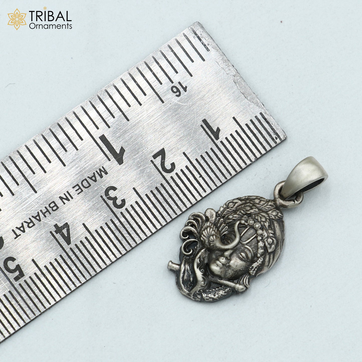 925 sterling silver Lord Krishna pendant from Tribal Ornaments, featuring tribal-style jewelry design.
