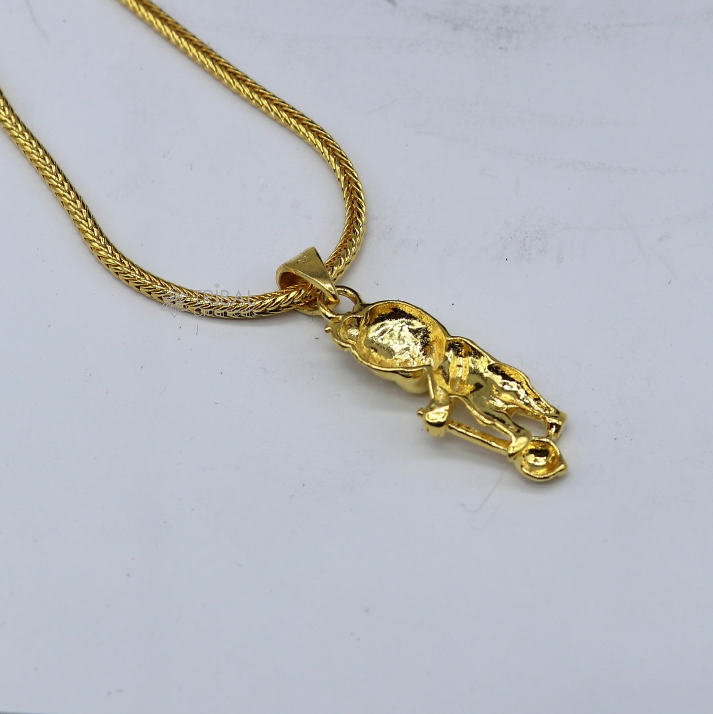 Sterling silver Lord Hanuman pendant with gold polish, handmade tribal ornament, featuring Lord Mugan or Kartikeya design.