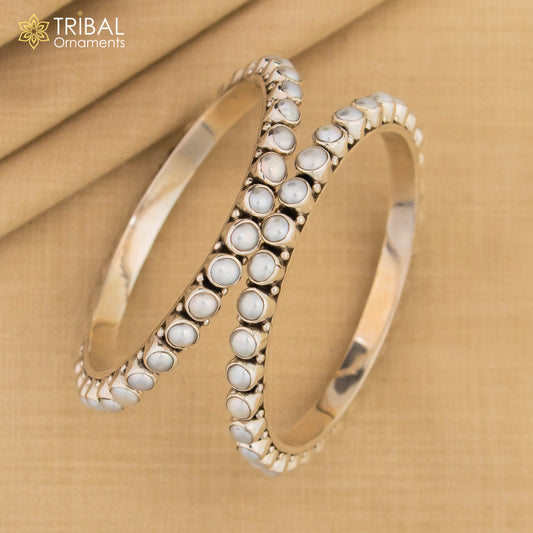 Sterling silver pearl bangle bracelet by TRIBALORNAMENT featuring oxidized finish, perfect for bridal or special occasion jewelry.