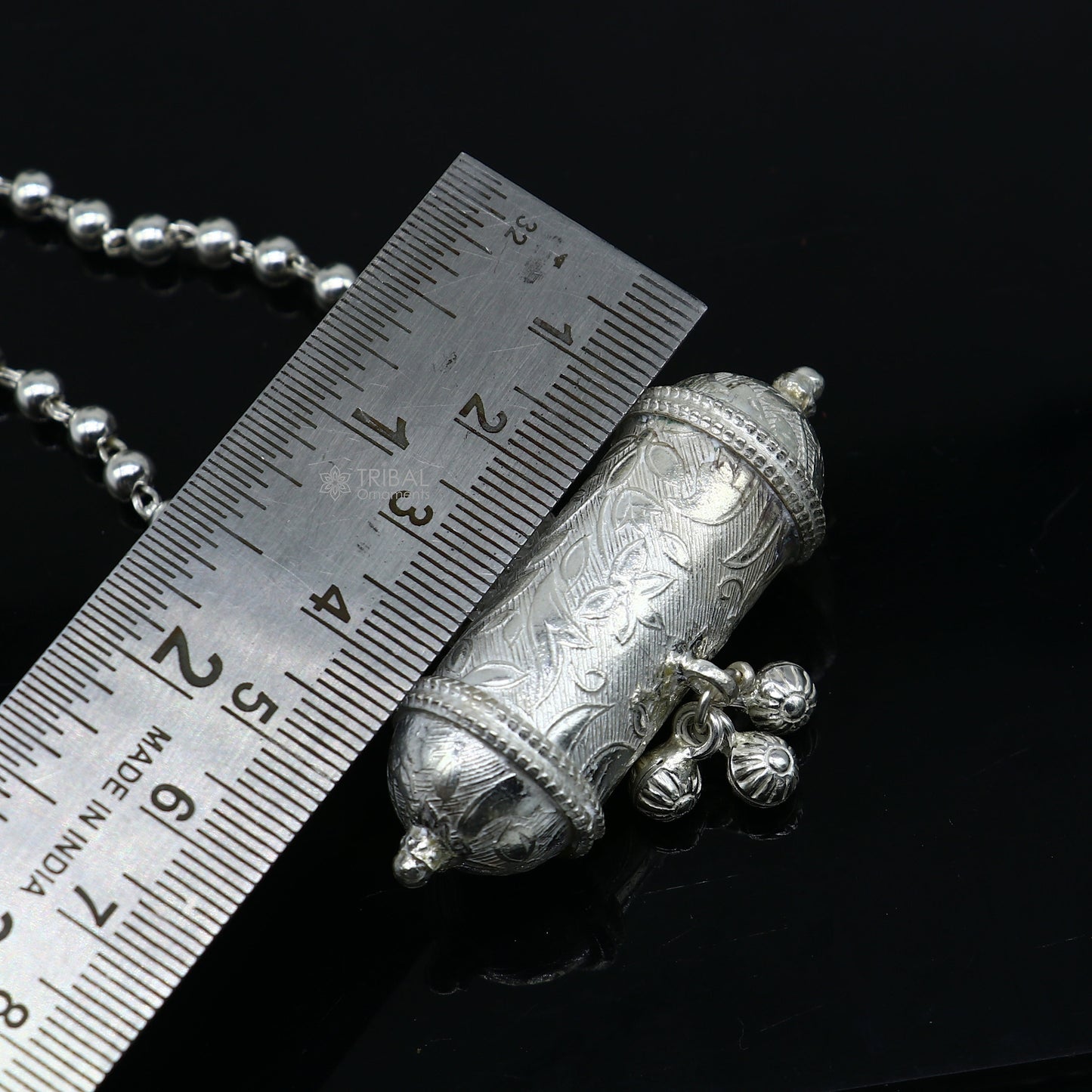 Vintage 925 sterling silver amulet pendant from TRIBAL ORNAMENTS' brides collection, displayed on a long necklace.
