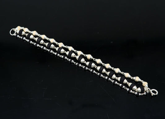 Black and white tulsi plant wood beaded sterling silver handmade 3-line bracelet from Tribal Ornaments.
