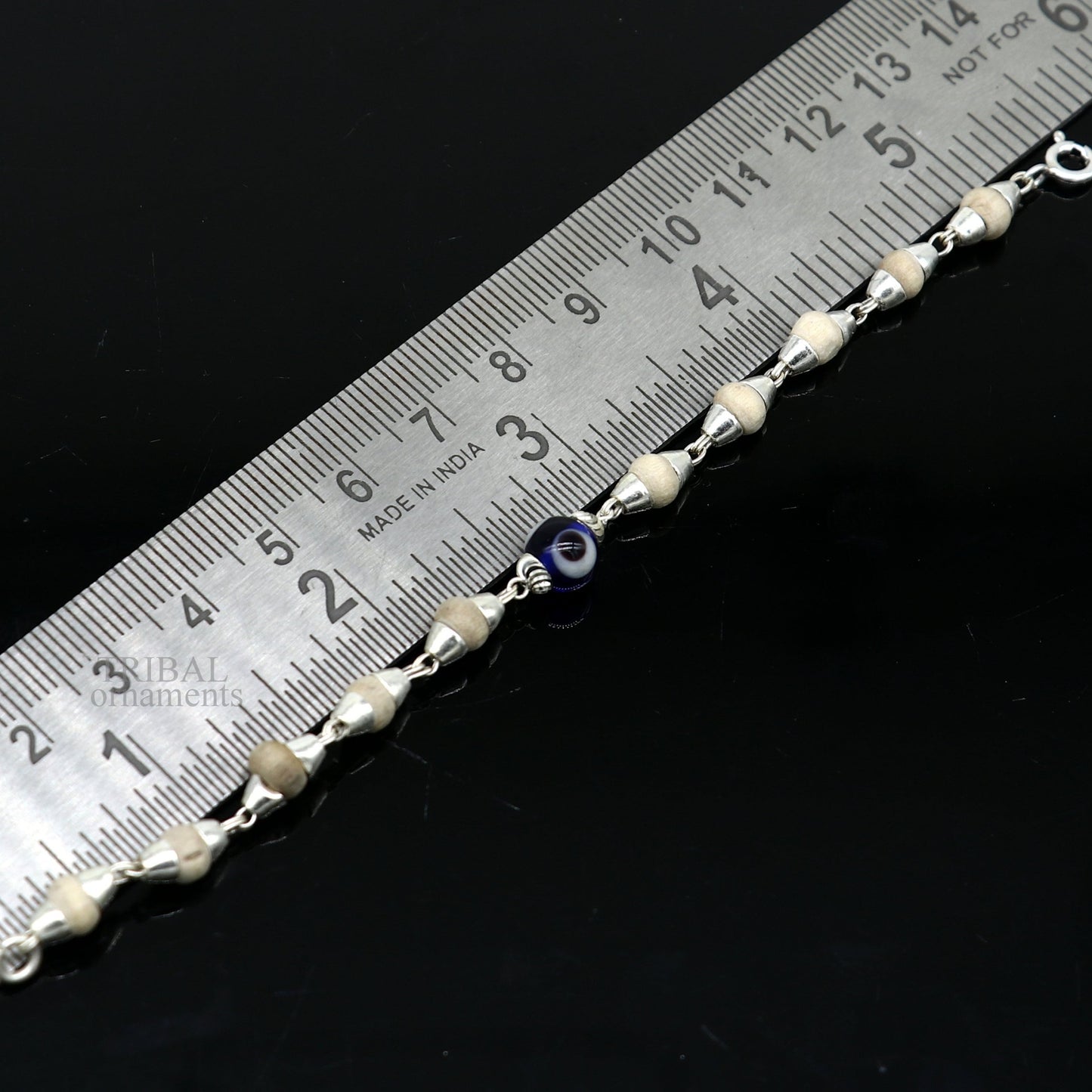 Sterling silver baby Tulsi bracelet with evil eye beads, handmade unisex jewelry by Tribal Ornaments, 5-inch size.
