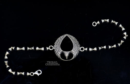 925 sterling silver Lord Garuda design Tulsi beaded bracelet rakhi by TRIBAL ORNAMENTS with black basil beads and intricate silver details.