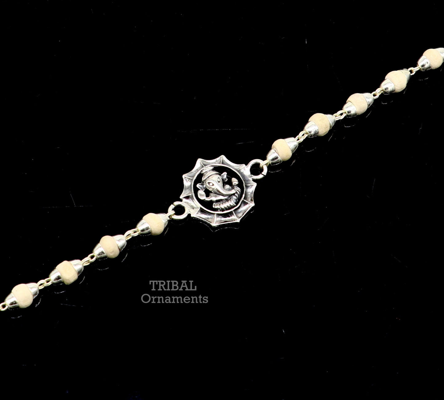 925 sterling silver Lord Ganesha design Tulsi beads bracelet rakhi with black basil and handmade detailing by Tribal Ornaments.