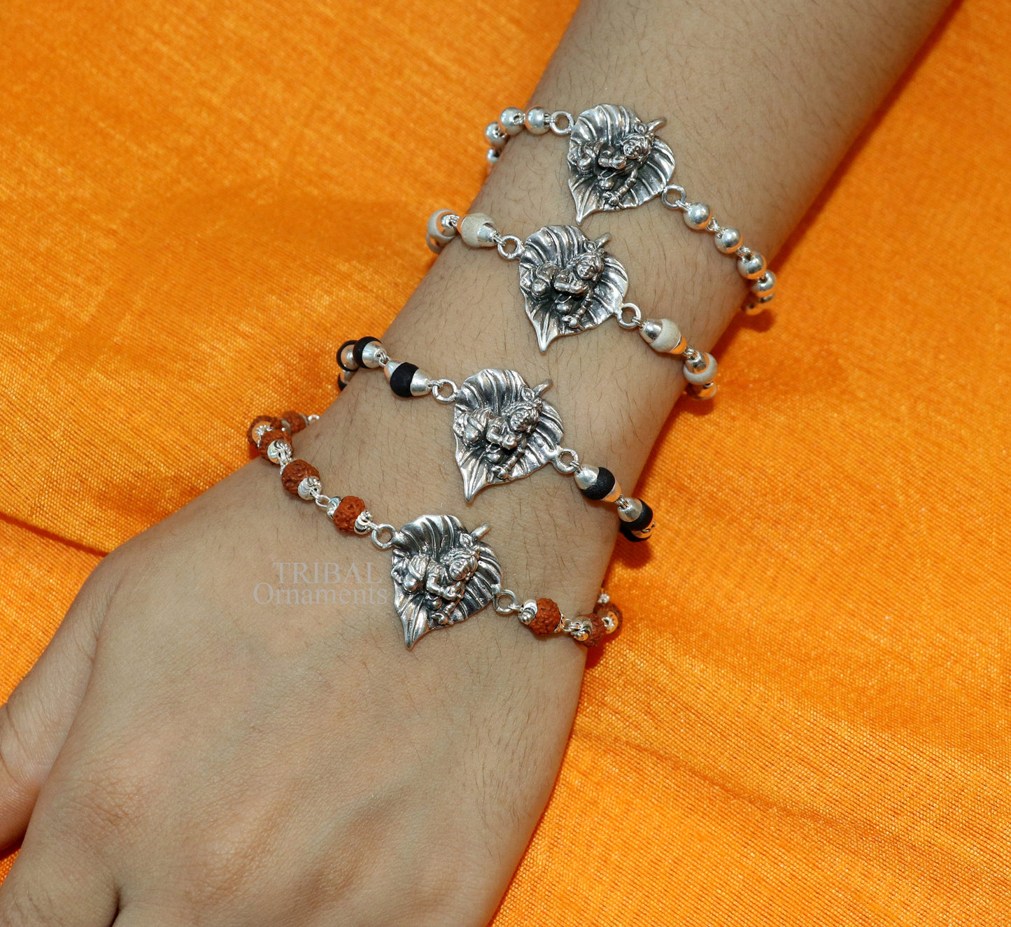 925 sterling silver Laddu Gopala design bracelet with Rudraksha and Tulsi beads, featuring intricate Krishna motif by TRIBAL ORNAMENTS.