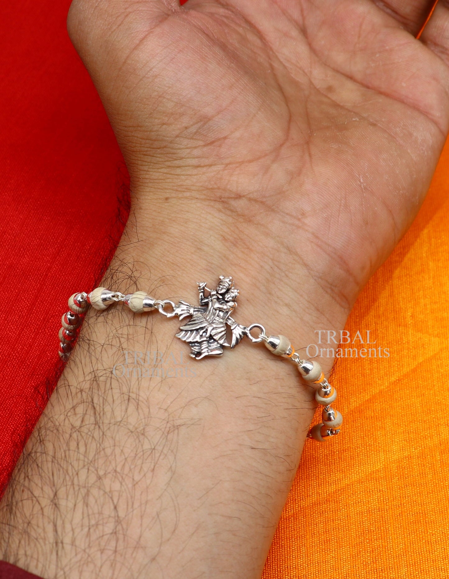 Handmade 925 sterling silver Lord Radha Krishna Rudraksha and Tulsi beads bracelet rakhi with intricate design and divine spiritual elements.