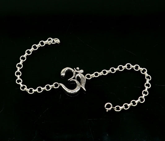 Sterling silver OM mantra bracelet by Tribal Ornaments, handmade 7-inch bracelet with intricate Aum design, available in all sizes.