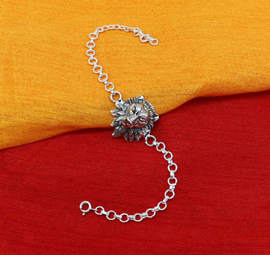 Sterling silver Narsimha lion face bracelet by TRIBAL ORNAMENTS, handmade with intricate design, available in all sizes.