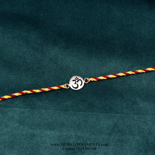 Sterling silver handmade AUM design thread bracelet by TRIBAL ORNAMENTS with intricate tribal-style detailing.