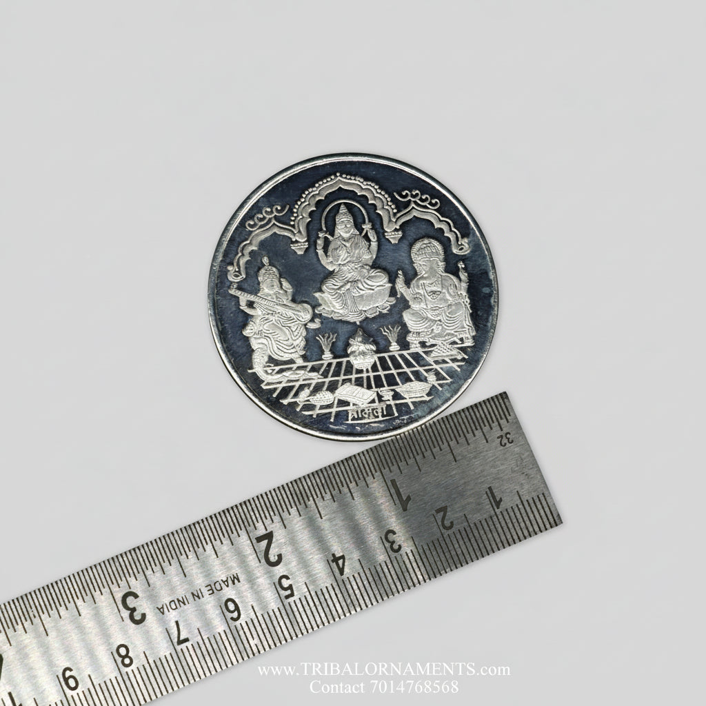 Silver Ganesha, Lakshmi, Saraswati coins from Tribal Ornaments, 50 grams, featuring intricate religious deity designs for Diwali.