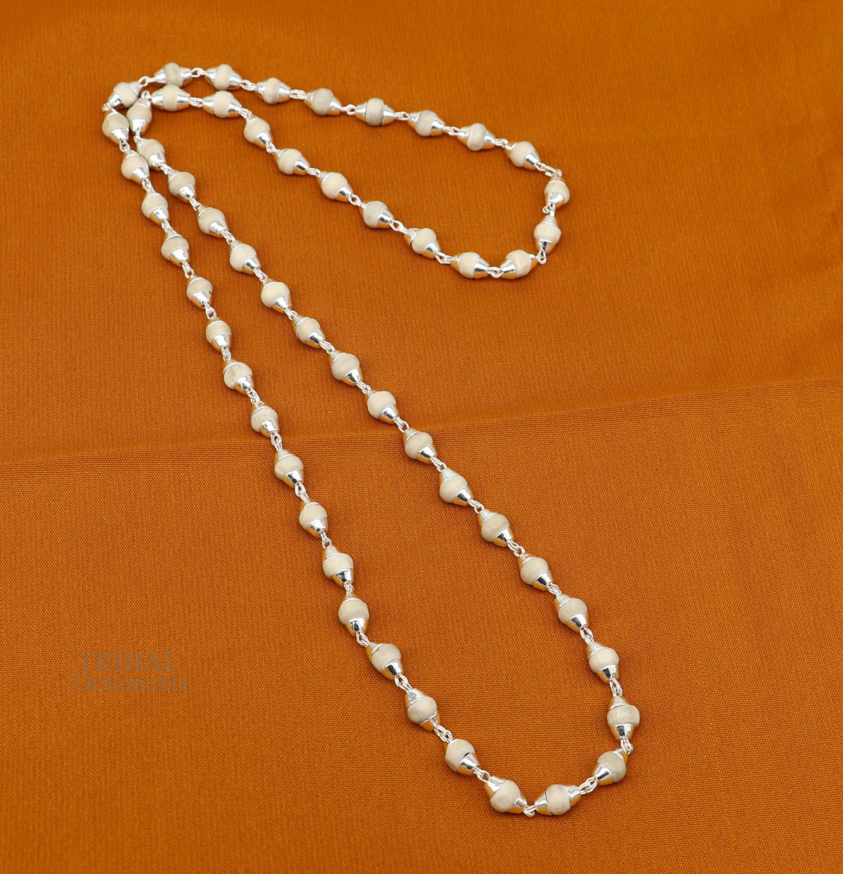 Sterling silver Tulsi mala necklace with wooden basil plant beads and silver chain, ideal for Ayurveda meditation and spiritual practices.