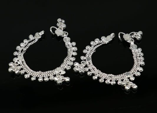 Handmade sterling silver vintage-style baby ankle bracelet with noisy sound bells and charm, designed for newborns.