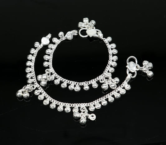 Handmade sterling silver baby ankle bracelet with delicate charm, 5 inches long, unisex design, tribal ornaments brand.