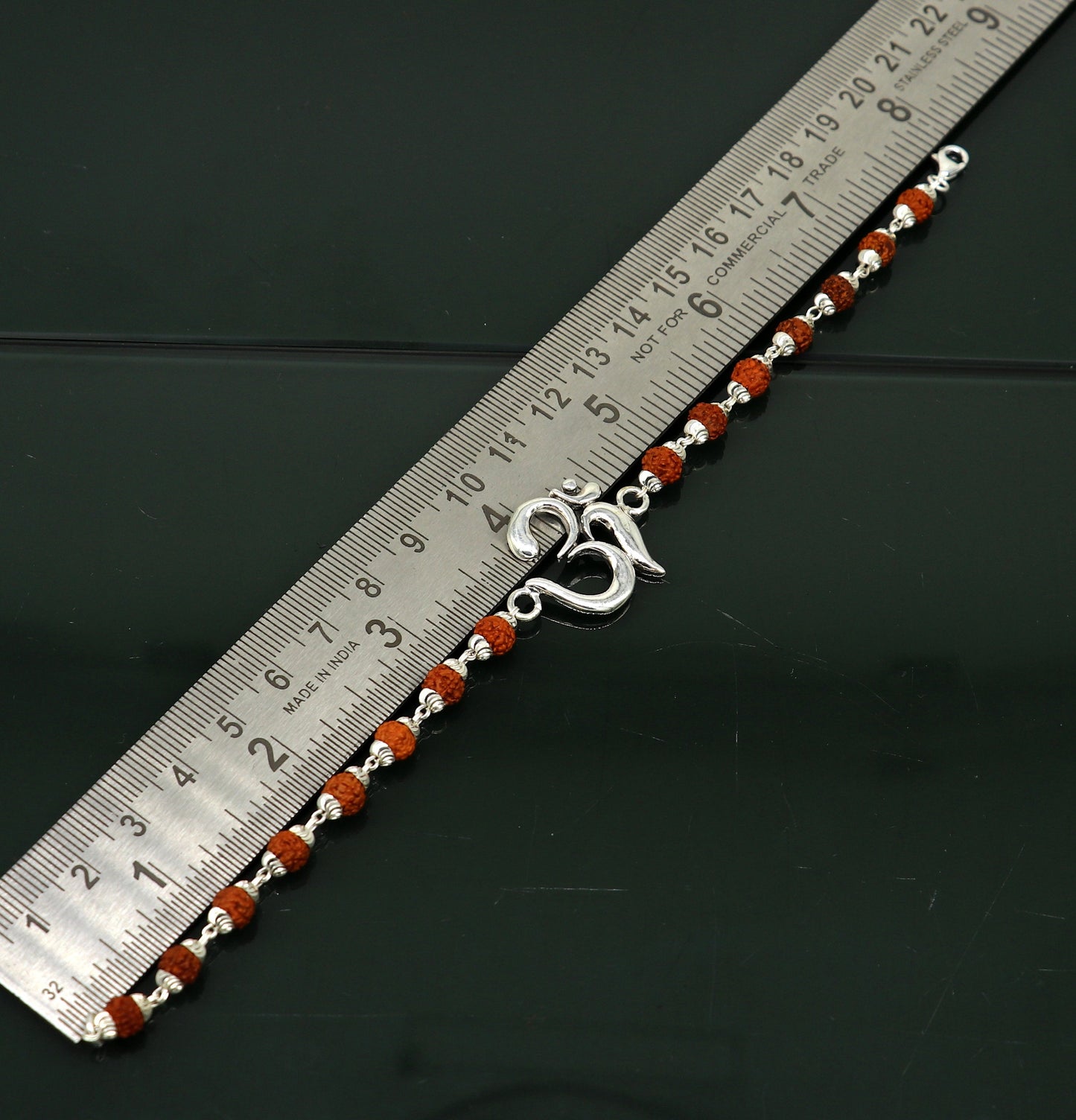 925 Sterling Silver OM Rudraksha beaded bracelet with Aum symbol, handcrafted tribal design, featuring beaded accents and intricate details