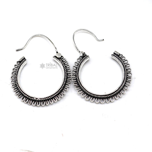 Sterling silver tribal earrings with unique round hoop design, ethnic hanging style, crafted by TRIBAL ORNAMENTS.
