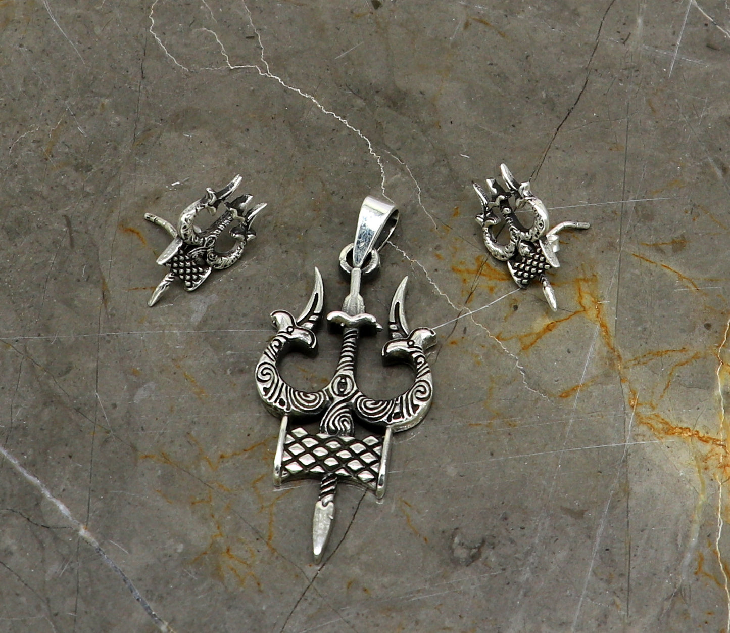 925 silver Shiva idol trident pendant and stud set from TRIBAL ORNAMENTS, featuring handmade designer jewelry for daily wear and gifting.