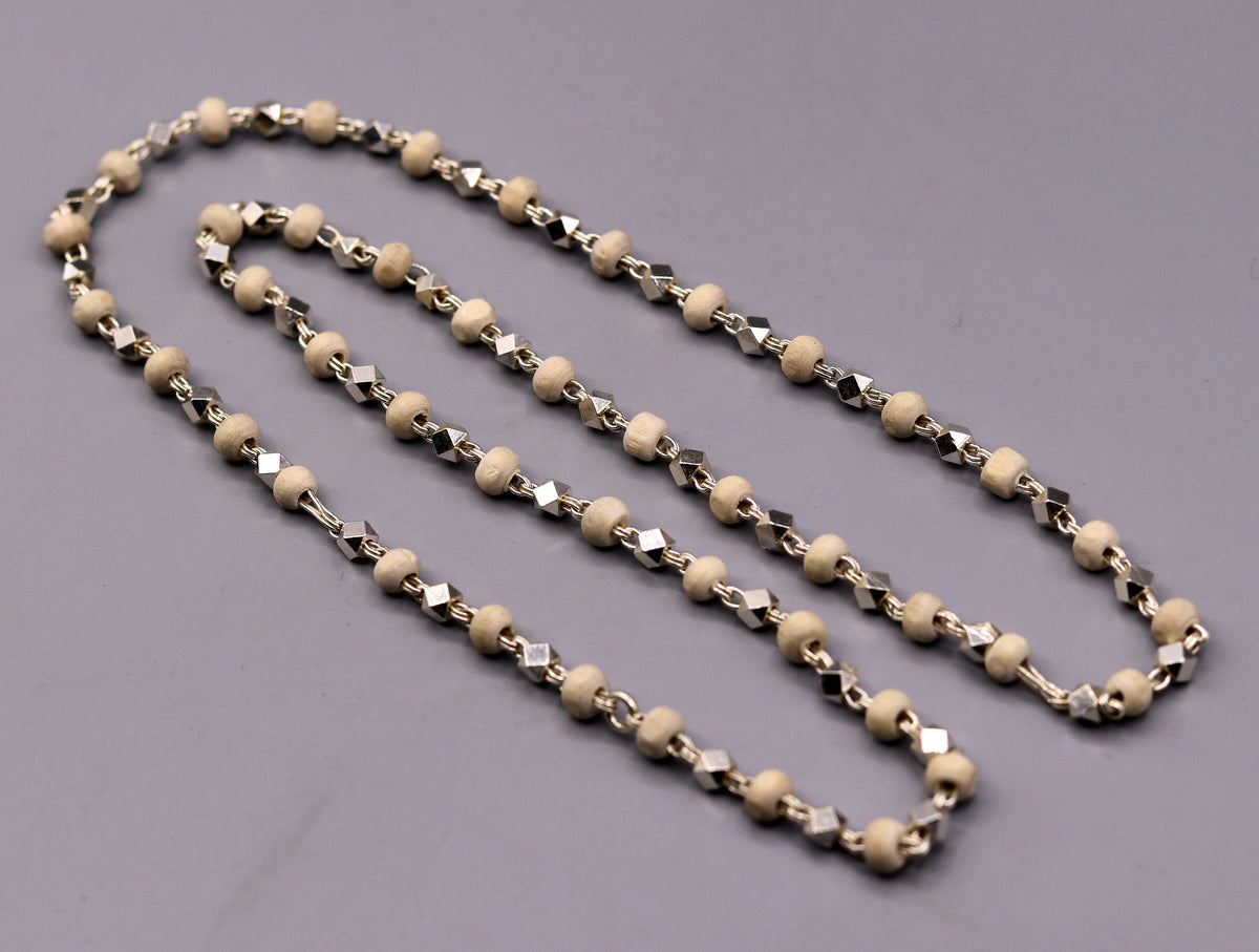 925 Silver handcrafted Basil rosary beads with silver beads on a necklace chain, used as Tulsi mala for Ayurveda and spiritual focus.