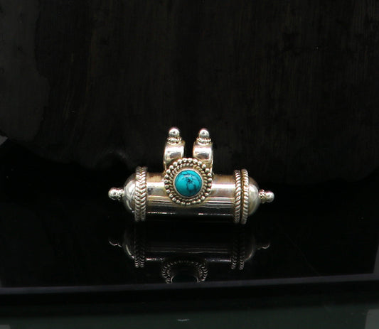 925 sterling silver tribal amulet pendant with vibrant turquoise stone in a box design, featuring intricate tribal jewelry details.