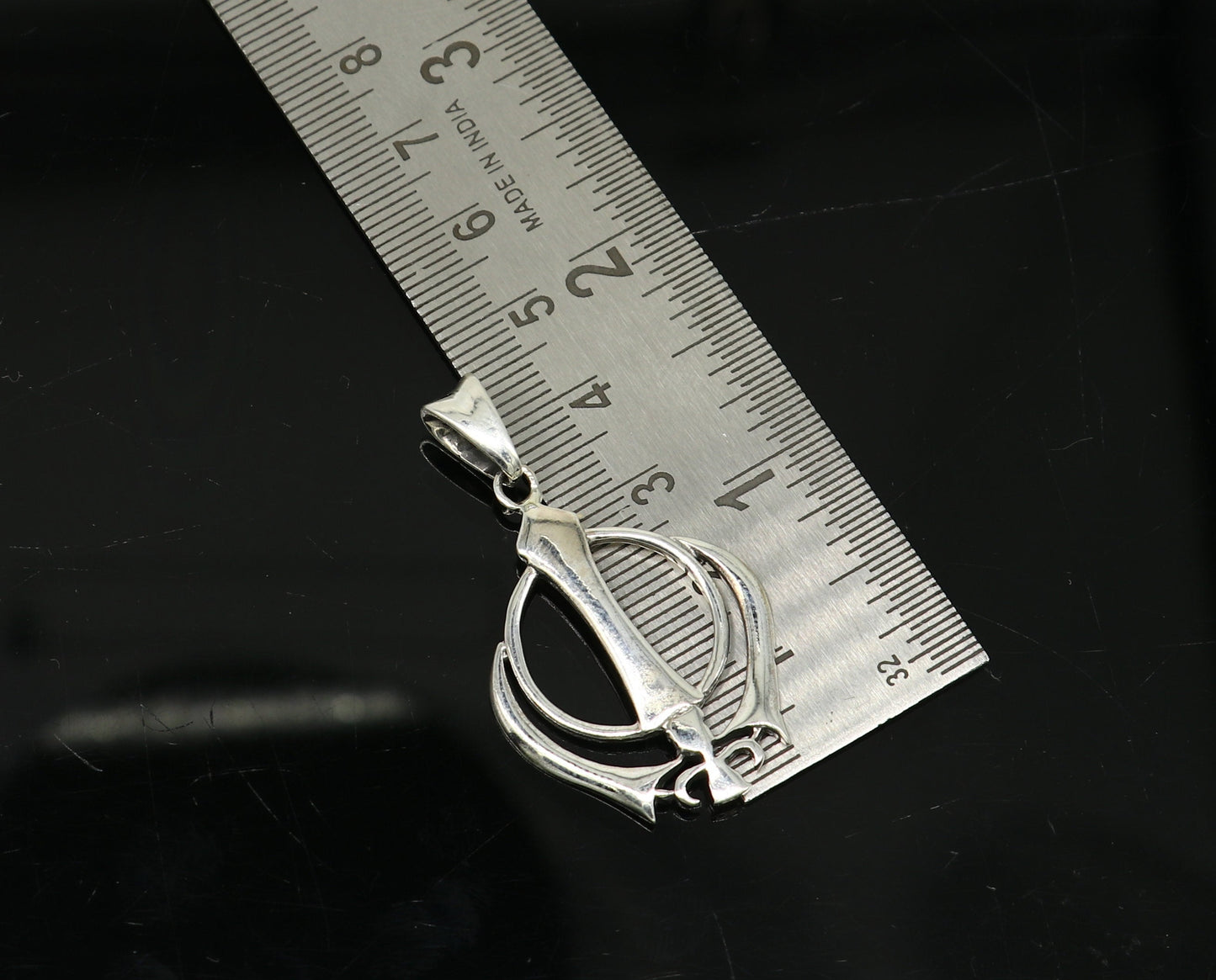 925 sterling silver Khalsa Waheguru symbol pendant with custom design, featuring Sikh blessing jewelry from TRIBAL ORNAMENTS.