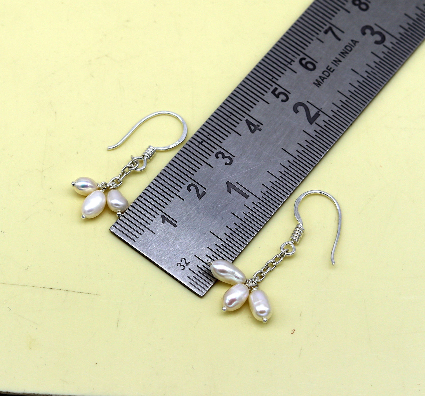 Sterling silver hoop earrings with tiny freshwater pearls, stylish and customized, perfect for bridesmaids and elegant occasions.