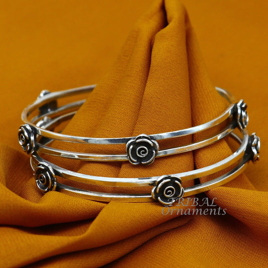 Sterling silver flower design bangle bracelet by TRIBAL ORNAMENTS, featuring intricate handmade floral jewelry for weddings.
