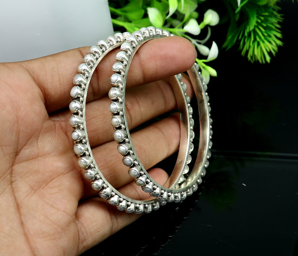 Sterling silver pearl bangle bracelet by TRIBAL ORNAMENTS with oxidized finish, perfect for bridal or special occasion jewelry from India.