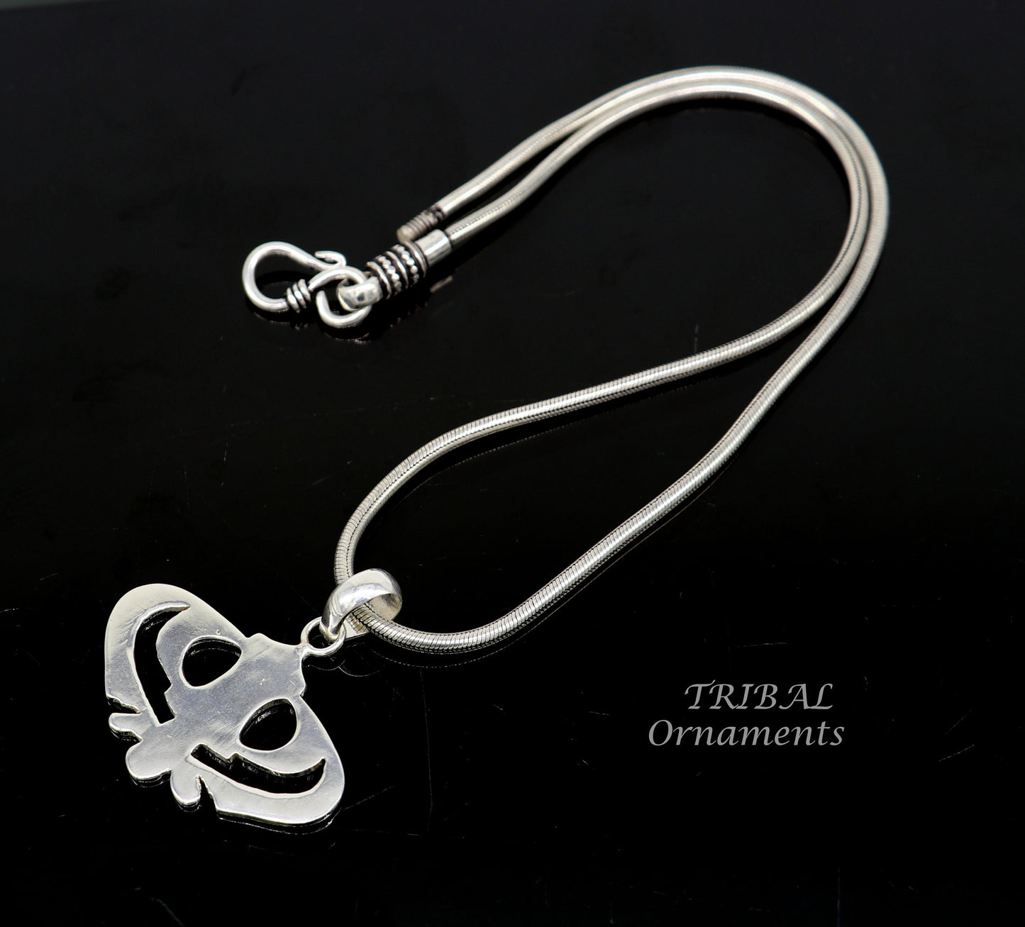 Sterling silver Khalsa Waheguru pendant with Sikha Sardar symbol, handmade jewelry featuring religious and cultural design.