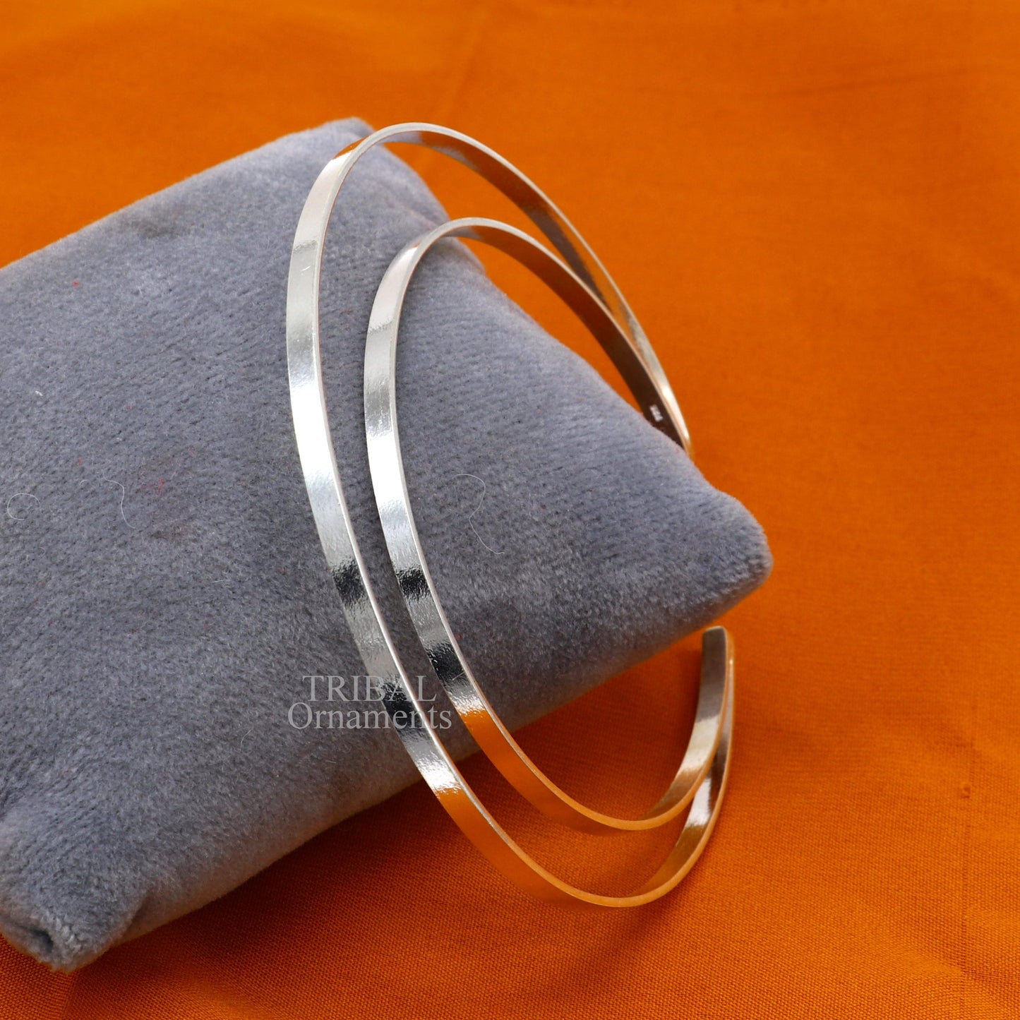 Sterling silver double-layer plain bangle bracelet by TRIBAL ORNAMENTS, featuring a sleek handmade cuff design with tribal jewelry style.