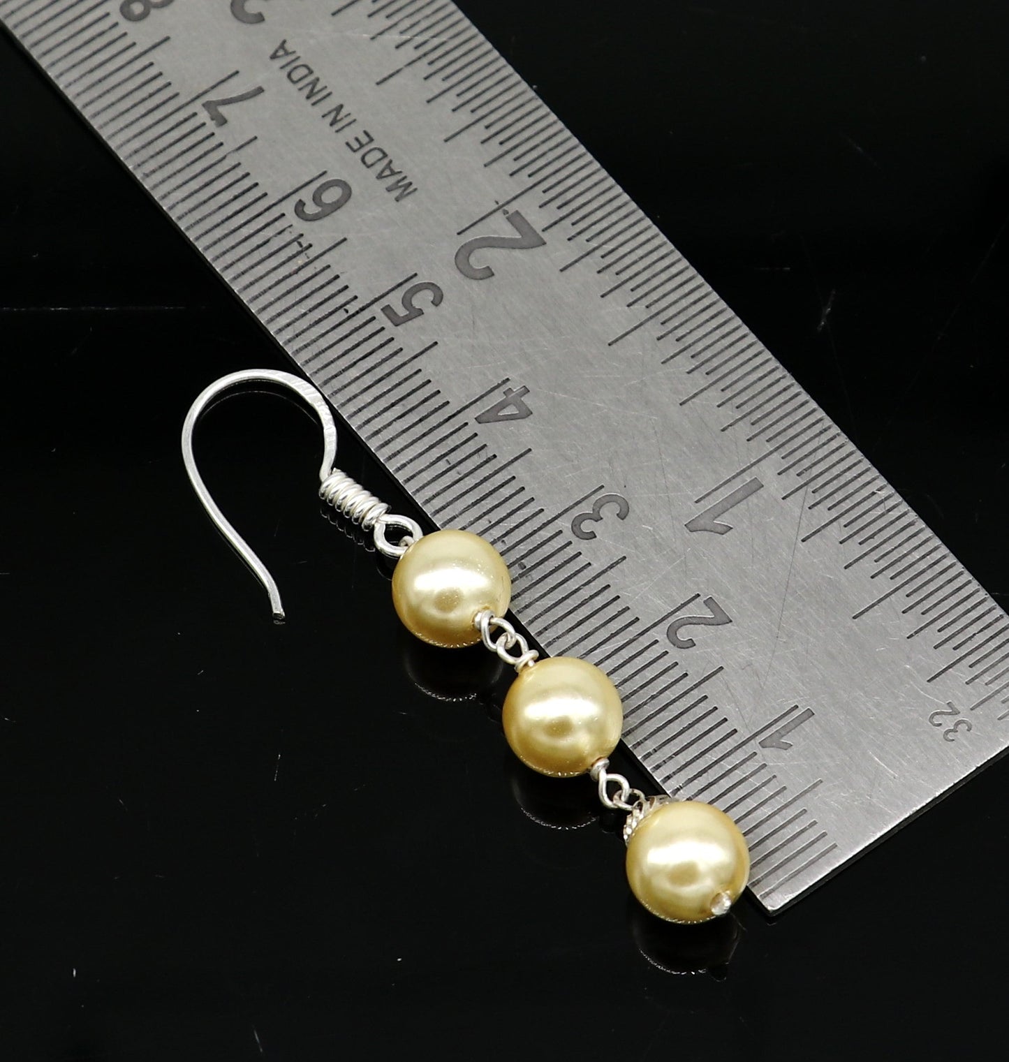 Sterling silver handmade hoop earrings with dangling pearls, perfect for bridesmaids and special occasions.