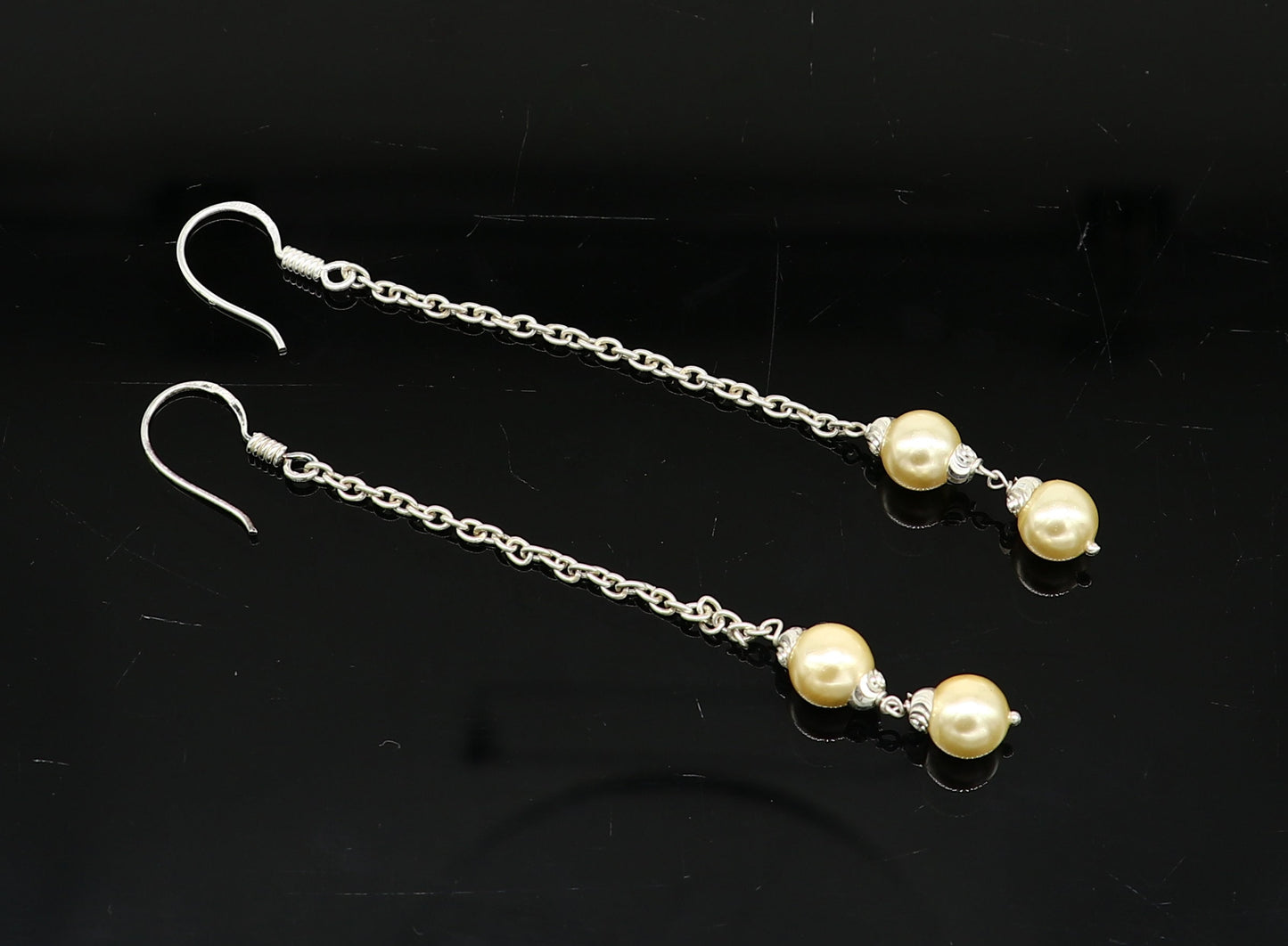 Sterling silver handmade pearl hoop earring with drop design, perfect for bridesmaids or special occasions.