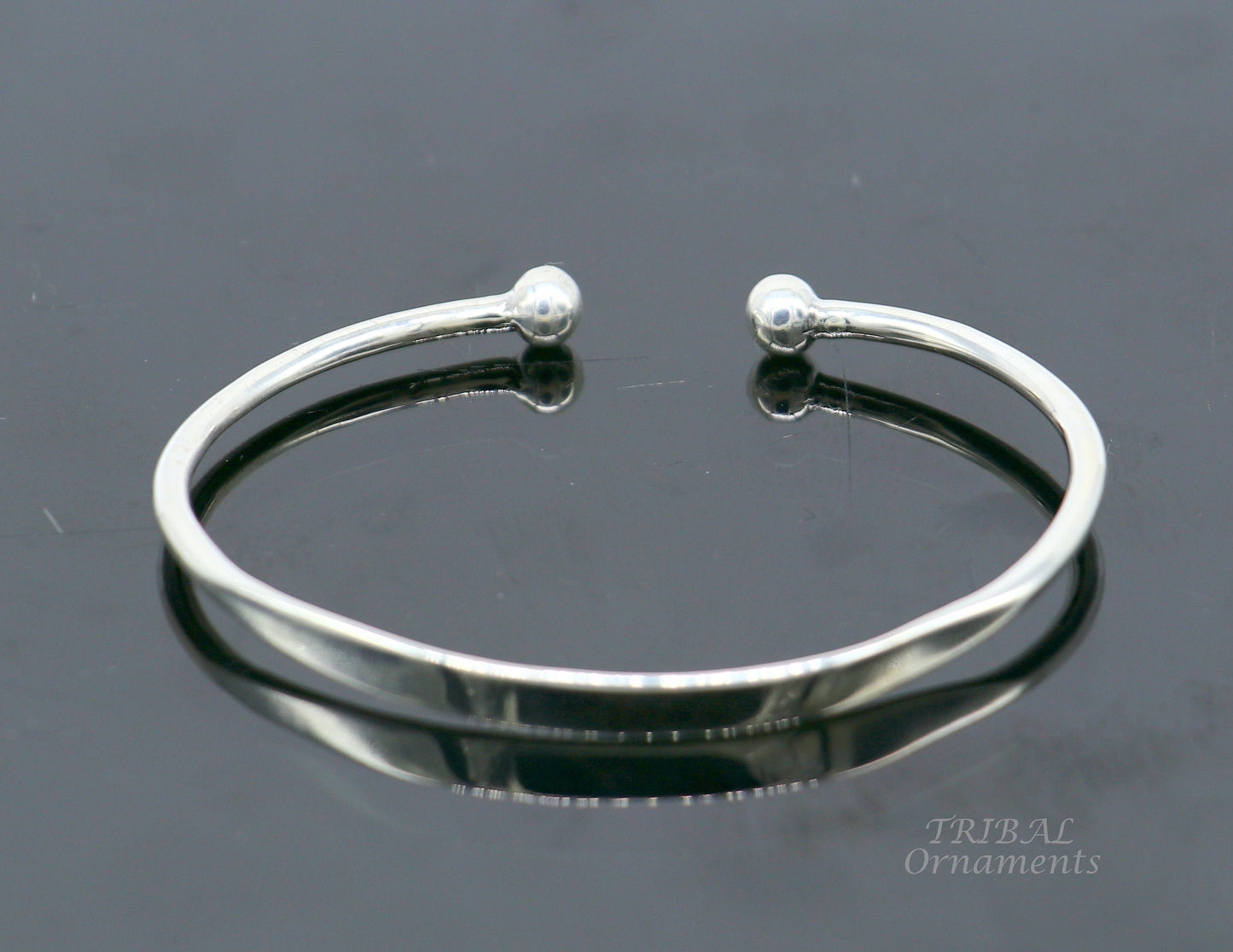 Sterling silver handmade bangle bracelet with a shiny plain design, stylish cuff or kada from TRIBAL ORNAMENTS.