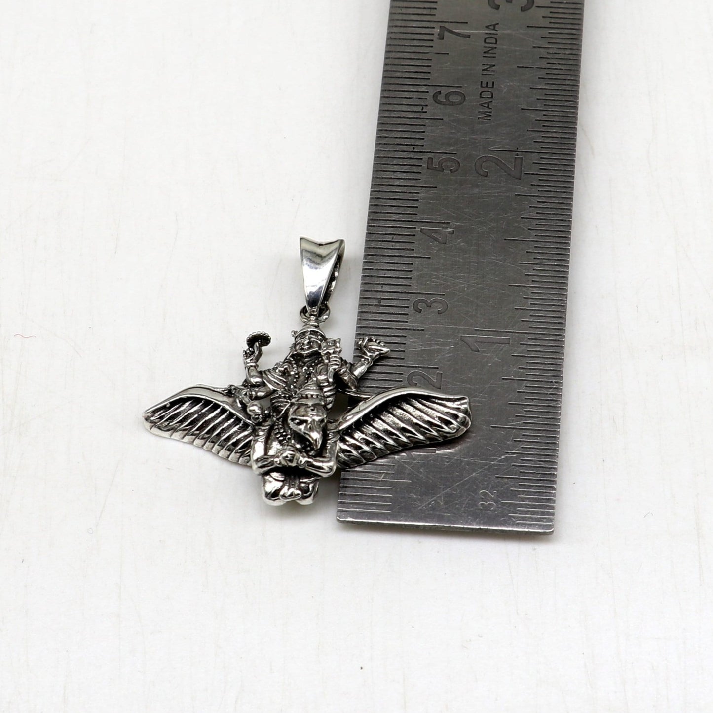 Unisex 925 sterling silver Lord Vishnu with Garuda pendant, detailed divine jewelry featuring intricate Hindu idol design.