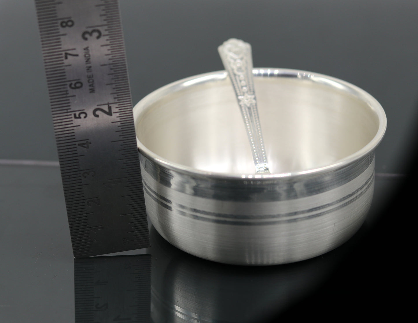 Handmade 999 pure silver bowl and spoon set with tray, designed for kids’ health, featuring tribal ornament style silver utensils.