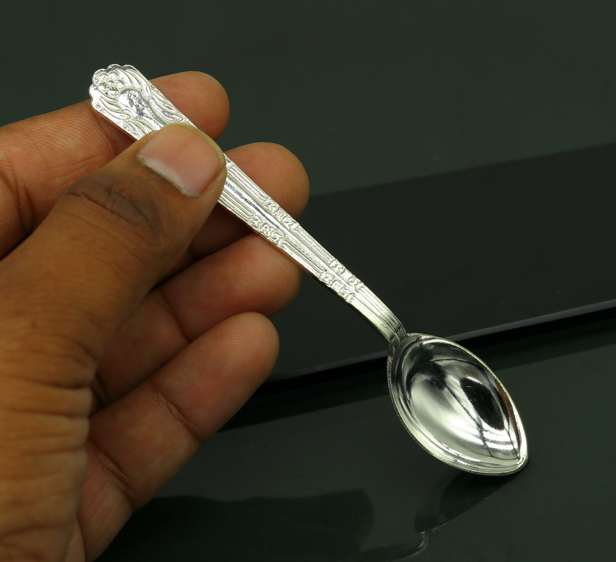 Fabulous sterling silver handmade 4.2-inch spoon by Tribal Ornaments, showcasing polished silver surface and traditional design.