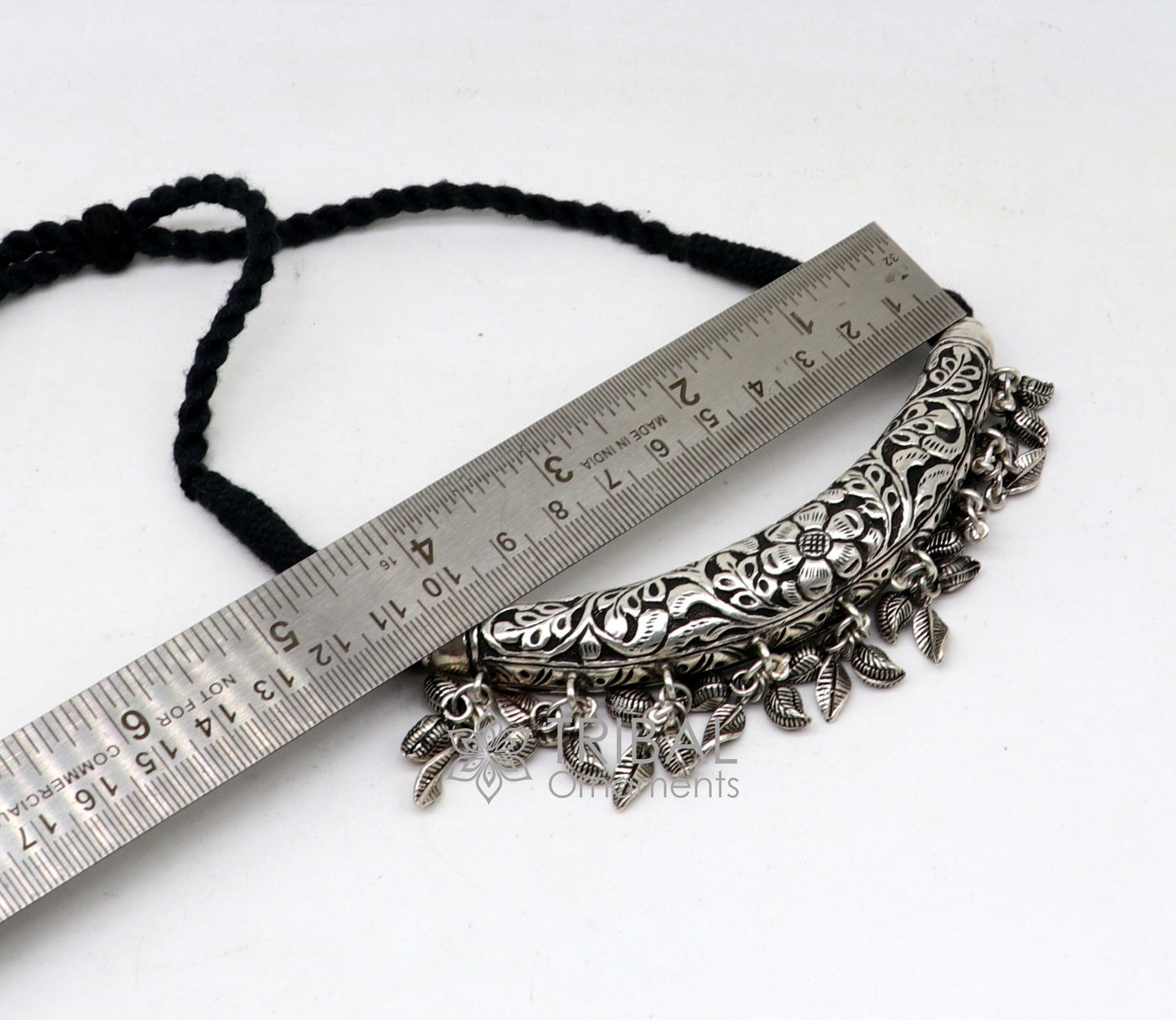 Indian traditional tribal silver necklace with kandrai charm, hasali and choker style, featuring intricate tribal jewelry design.