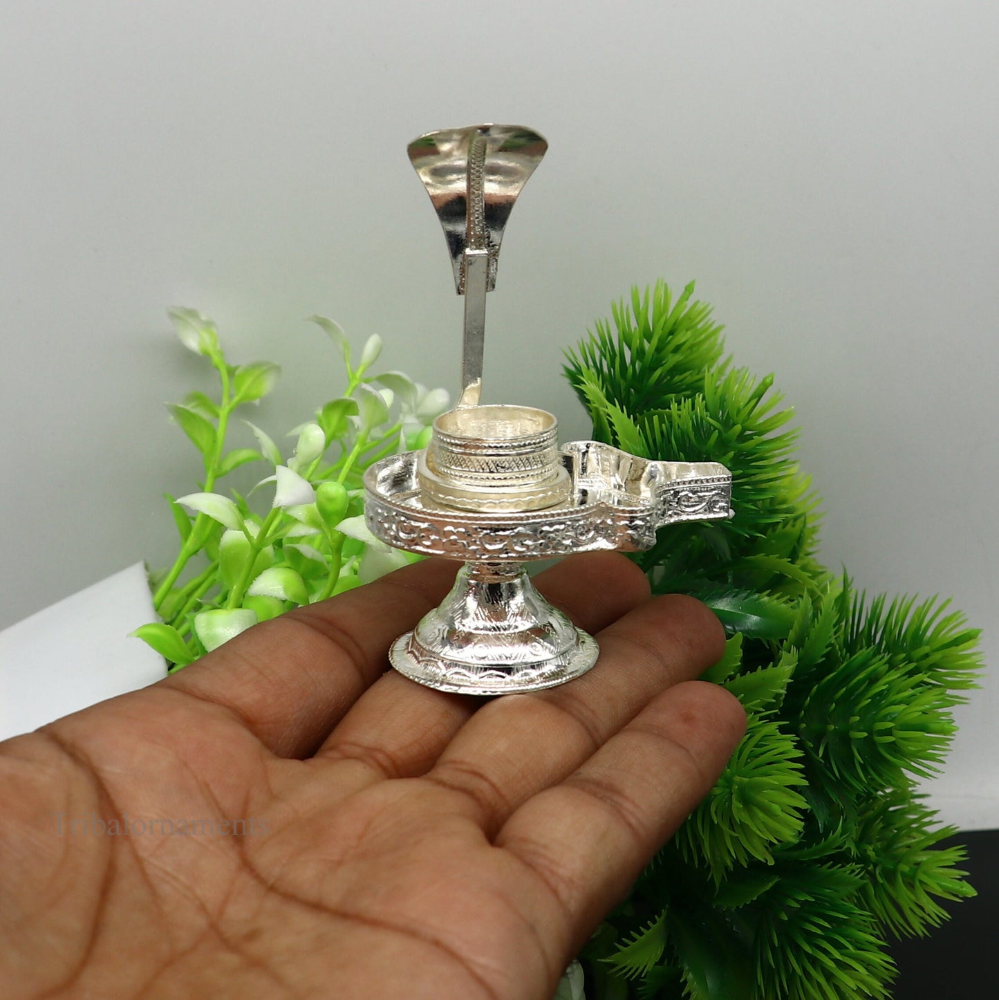 Pure 925 sterling silver Lord Shiva Lingam stand with intricate design, suitable for holding Shiva Lingam in home temple puja.