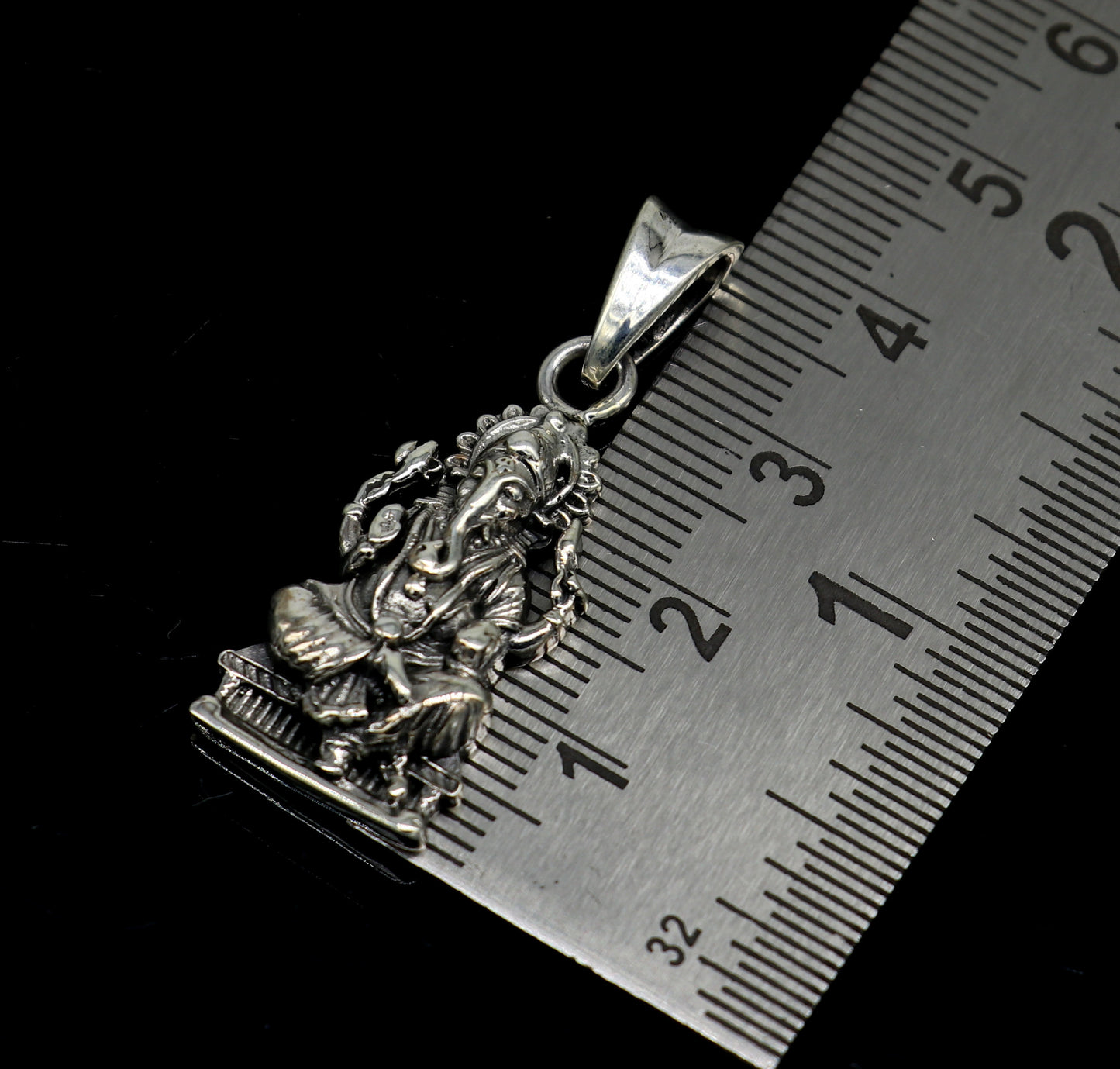Sterling silver Ganesha pendant featuring intricate Hindu goddess design, perfect for jewelry and gifting.