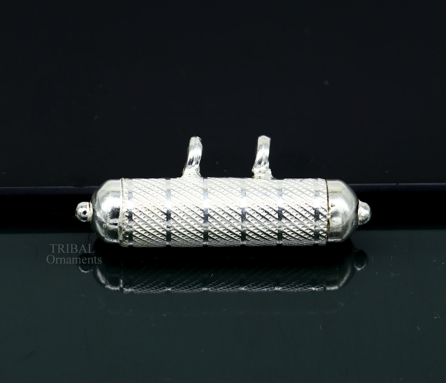 Solid sterling silver round amulet box pendant with handcrafted tribal design, featuring mantra and mascot motifs.