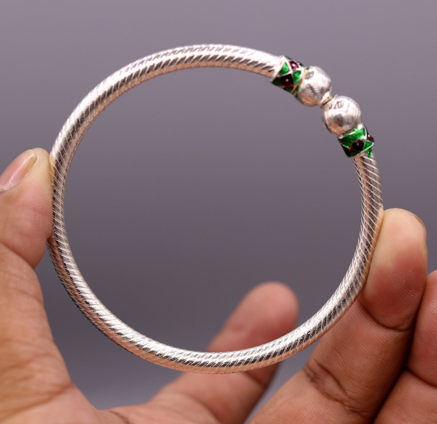 Pair of vintage tribal sterling silver bangles with antique design, handcrafted belly dance jewelry from Rajasthan, India.