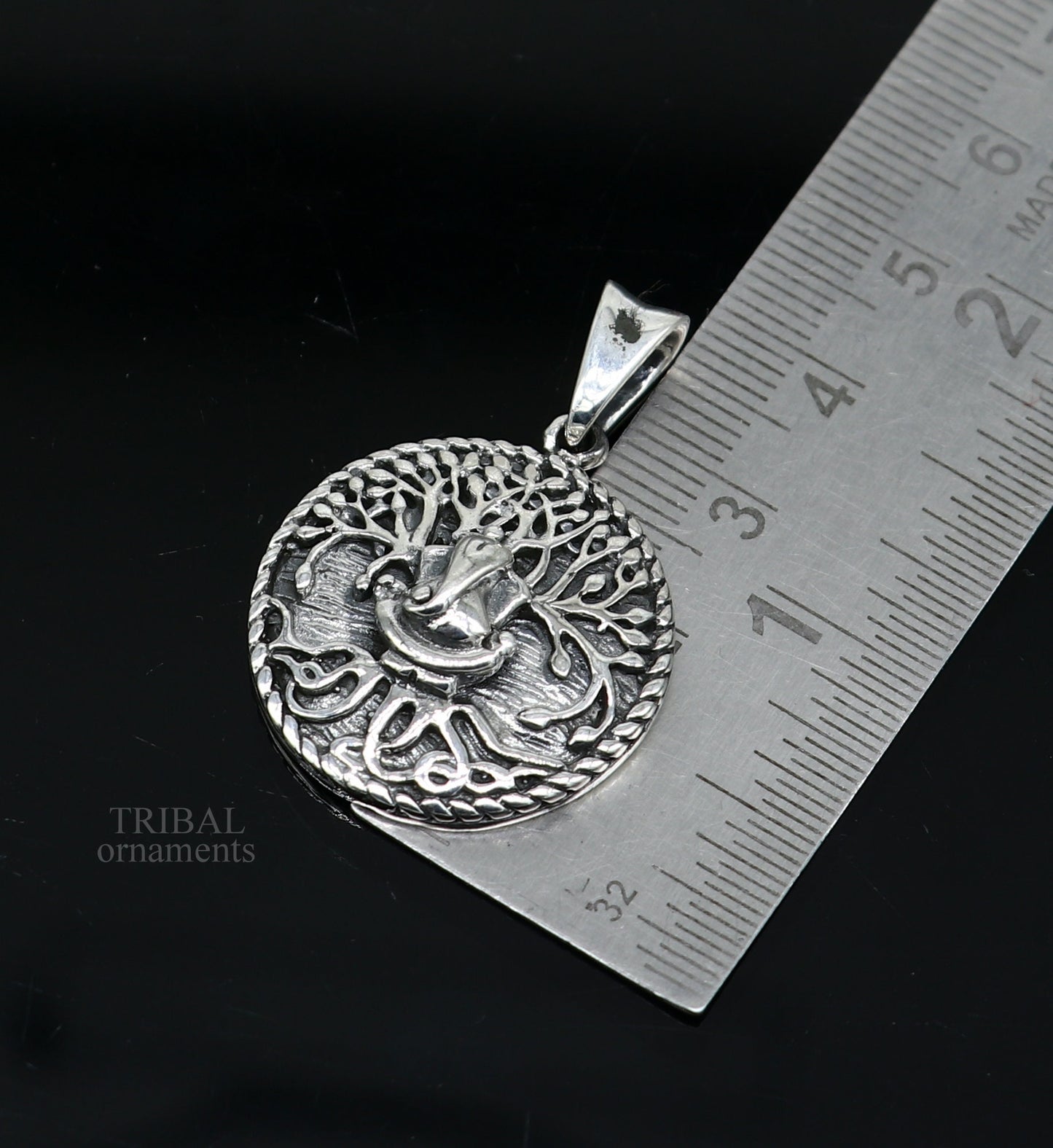 Sterling silver handmade Ganesha pendant by Tribal Ornaments, stylish unisex tribal jewelry with intricate idol design.