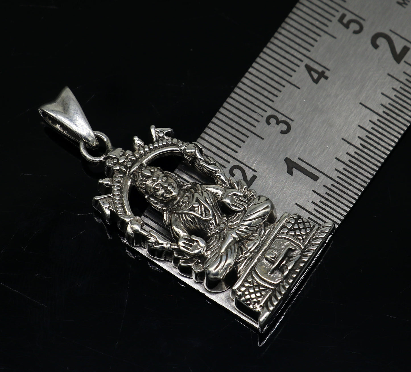 Sterling silver vintage Laxmi goddess pendant by TRIBAL ORNAMENTS, detailed antique-style unisex jewelry for gifting.