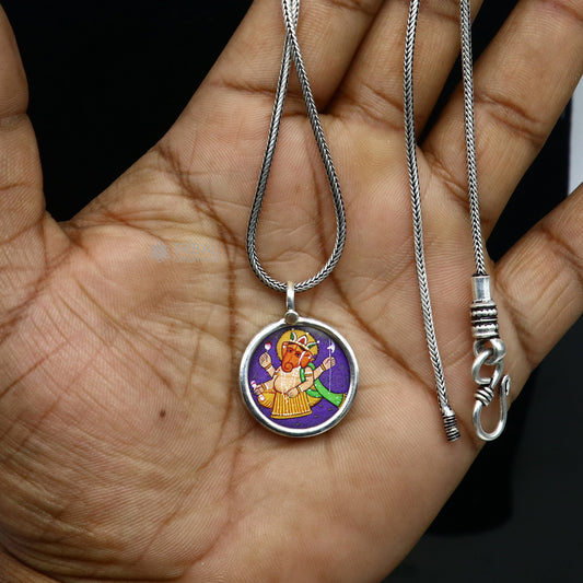 Sterling silver handmade Ganesha pendant with intricate painting, unisex jewelry from Tribal Ornaments, ideal for gifting.