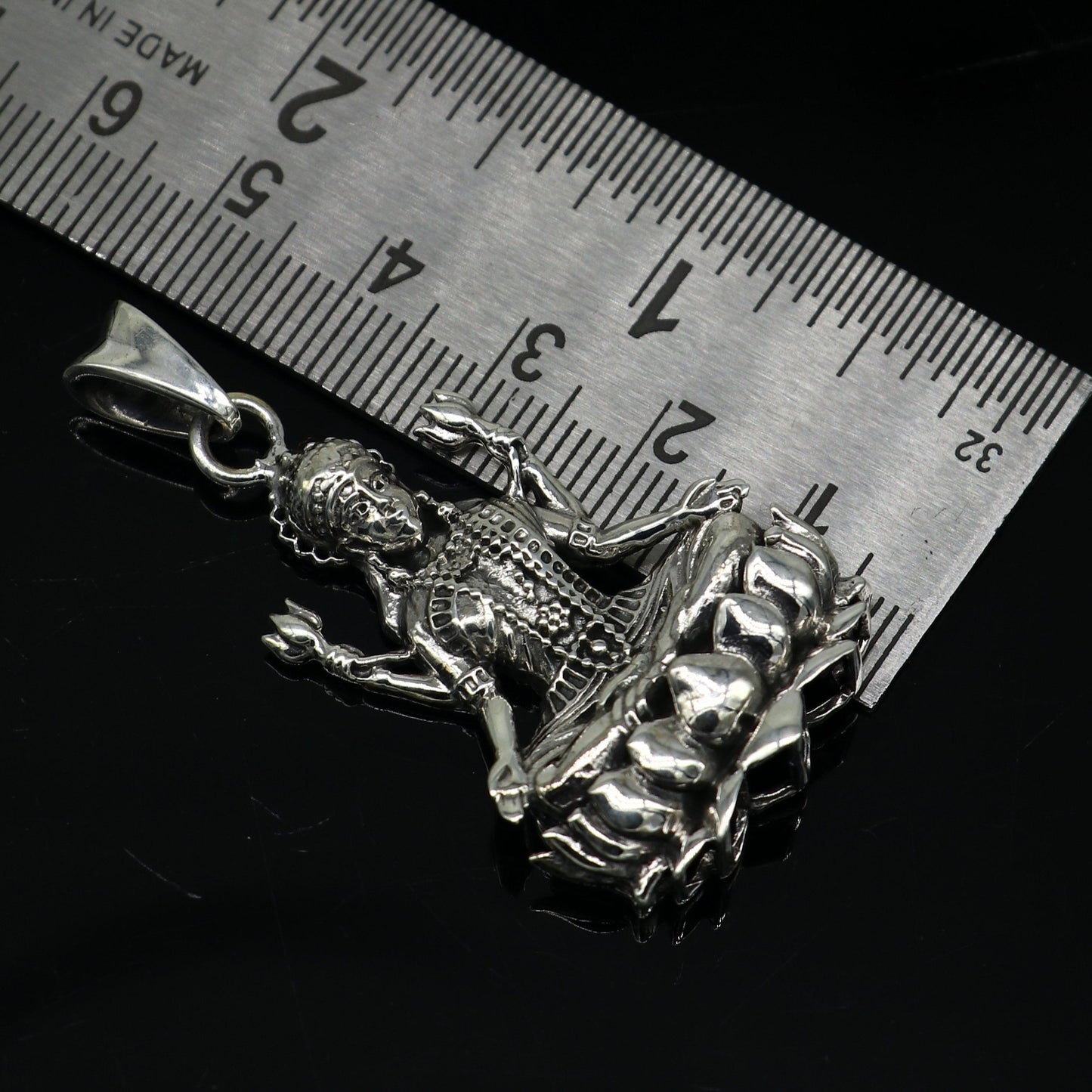Sterling silver Mahalaxmi goddess pendant by Tribal Ornaments, handmade unisex Hindu jewelry with intricate design.
