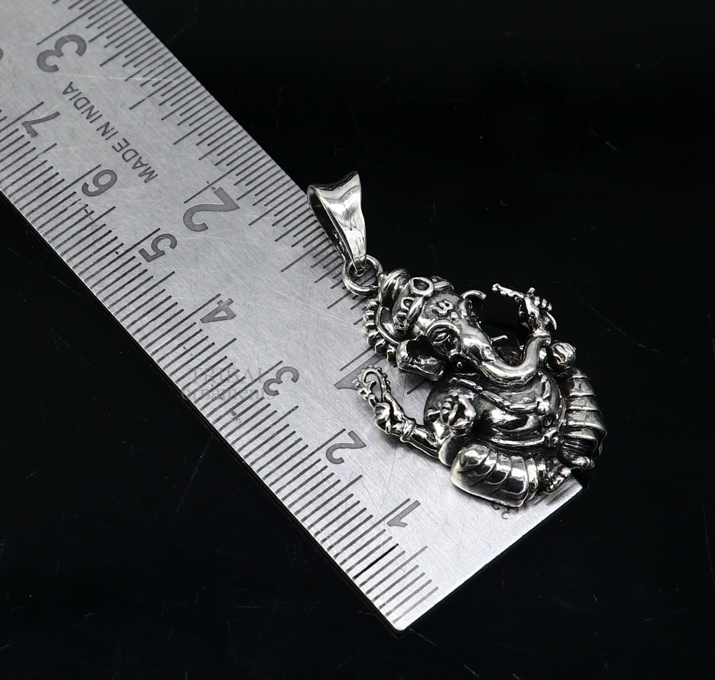 Unisex 925 sterling silver Lord Ganesha pendant from TRIBAL ORNAMENTS, featuring intricate handcrafted tribal design.