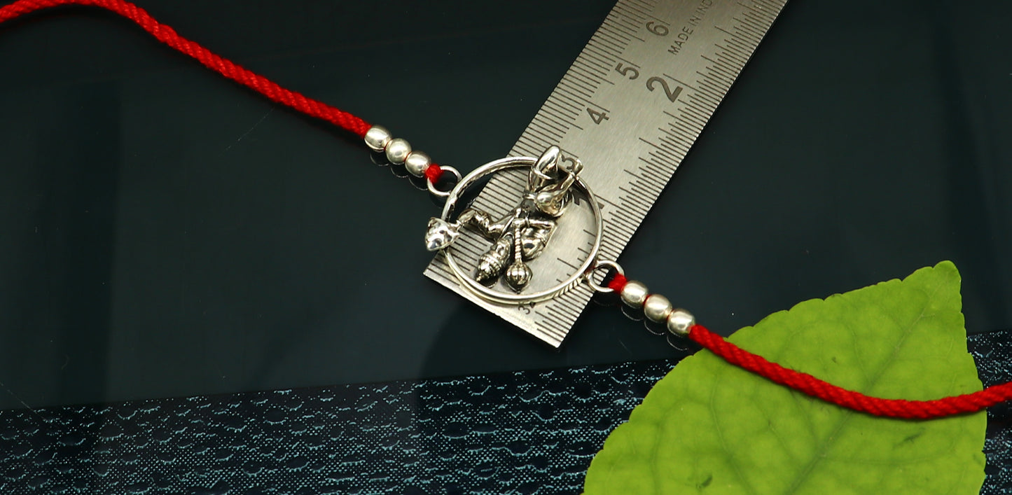 925 sterling silver Hanuman design bracelet with red thread rakhi, featuring intricate tribal ornament craftsmanship.