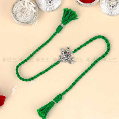 Silver Lord Saraswati Maa with Veena design thread rakhi bracelet in 925 Sterling silver from TRIBAL ORNAMENTS.